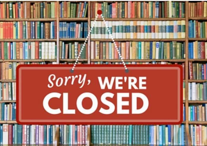 Closed sign in front of books